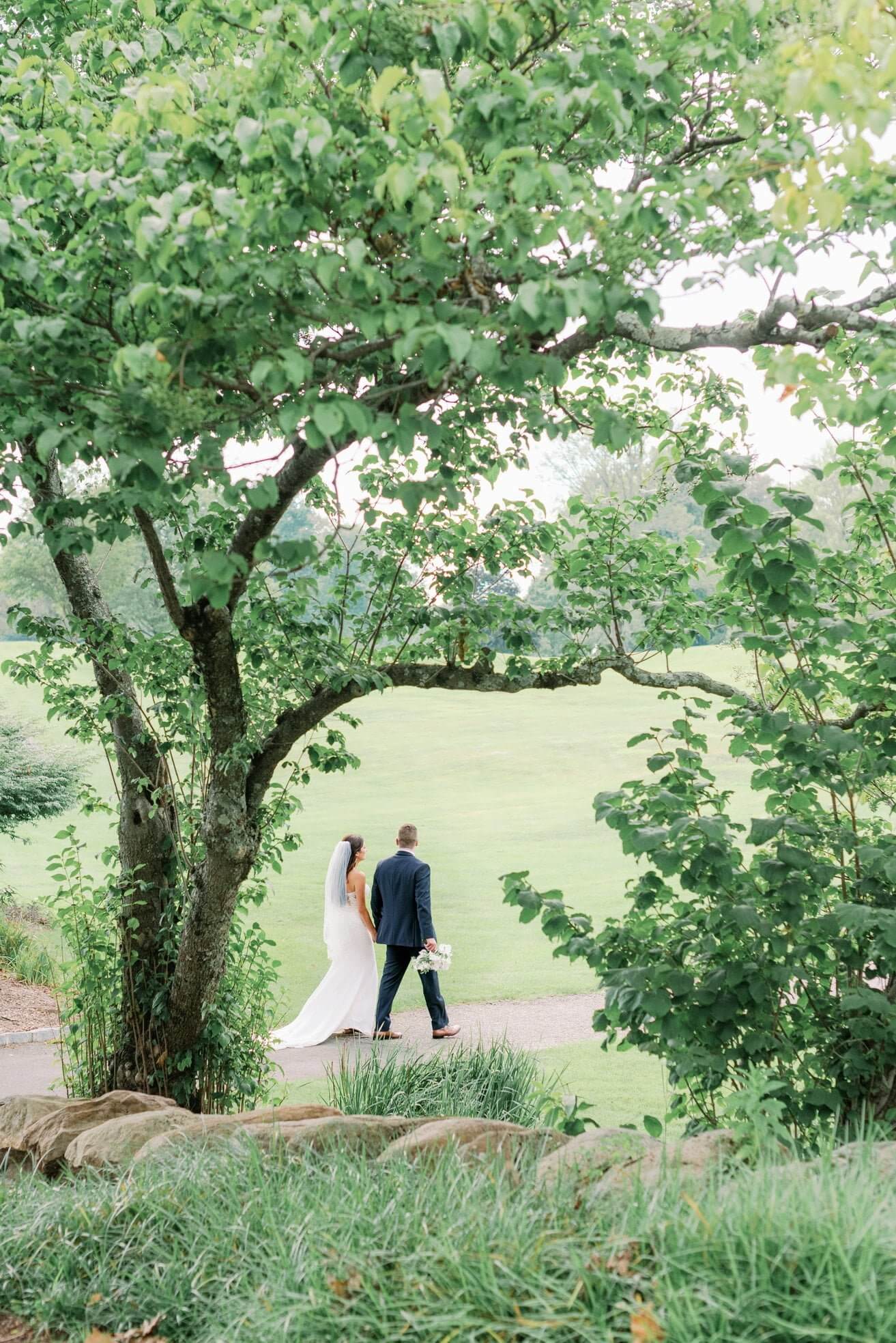 outdoor wedding bride groom walking tree brooklake nj outdoor wedding bride groom walking tree brooklake nj