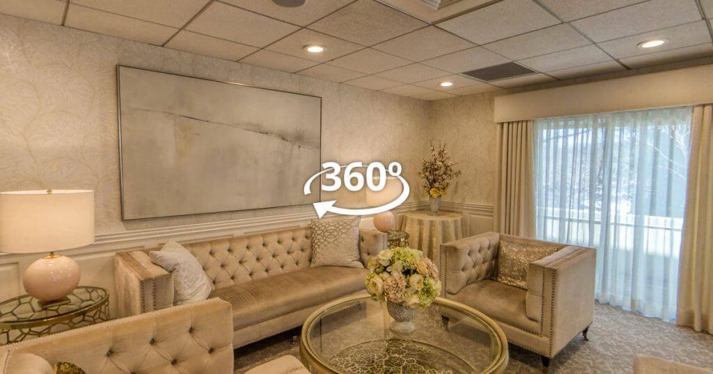 A living room with couches and a coffee table, ideal for intimate gatherings or events.