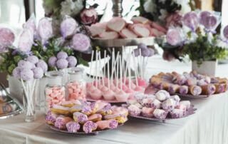table at a Bat Mitzvah party with a beautiful display of candy and desserts