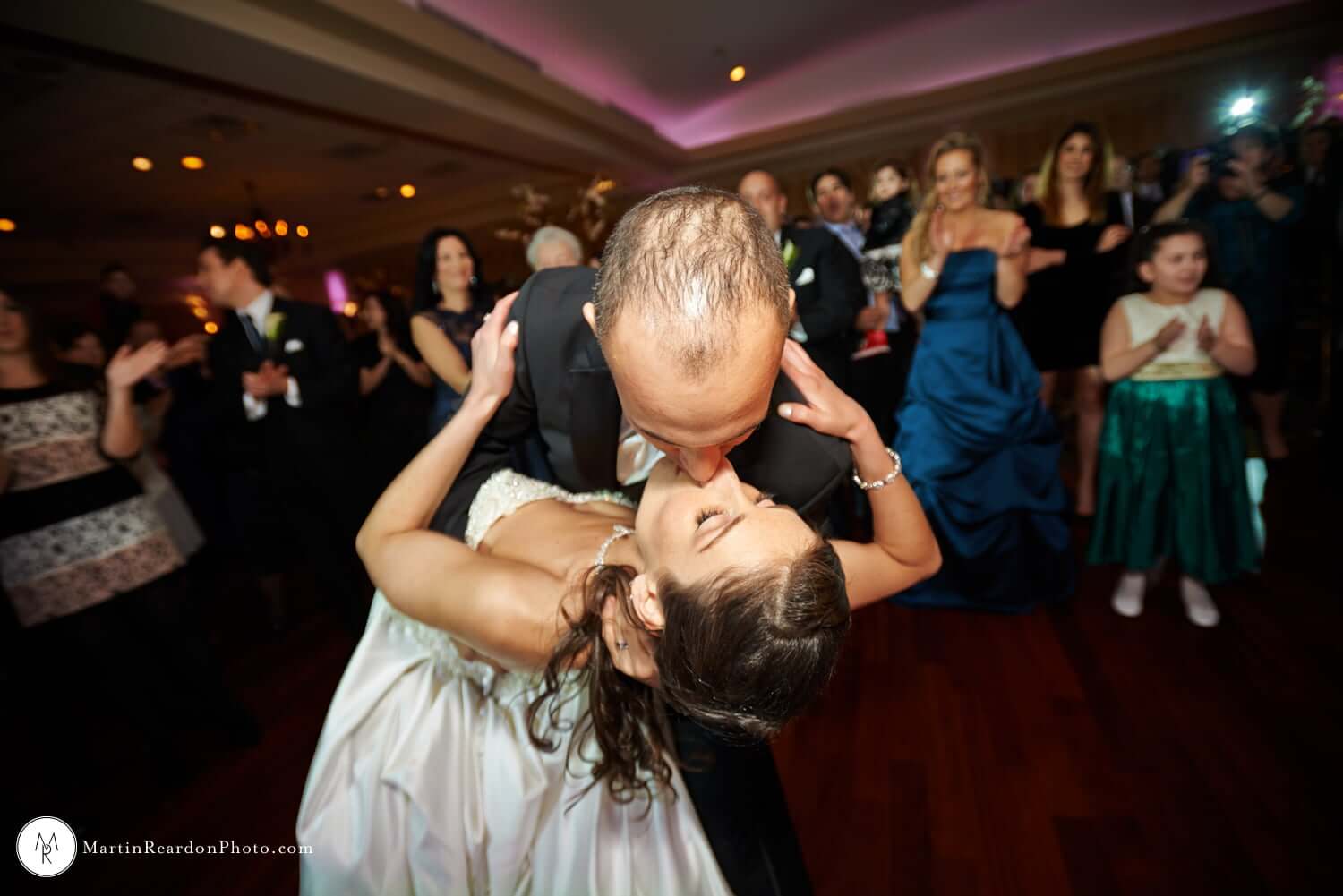 Brooklake-wedding-first-dance-kiss A bride and groom share a passionate kiss during their first dance at one of the stunning new jersey wedding venues.
