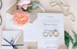 Navy wedding invitations adorned with elegant flowers and delicate pearls, perfect for couples celebrating their special day in charming New Jersey venues. These exquisite invitations capture the essence of a romantic Florham Park wedding, offering