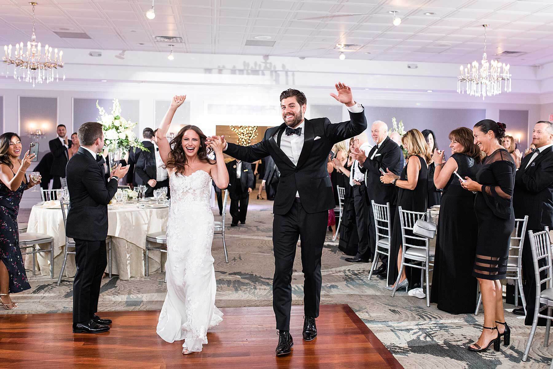 Jackie-Marino-of-Limelight-Entertainment-brooklake-county-club-dancefloor A bride and groom joyfully walk down the aisle at their outdoor wedding reception in one of the breathtaking New Jersey wedding venues.