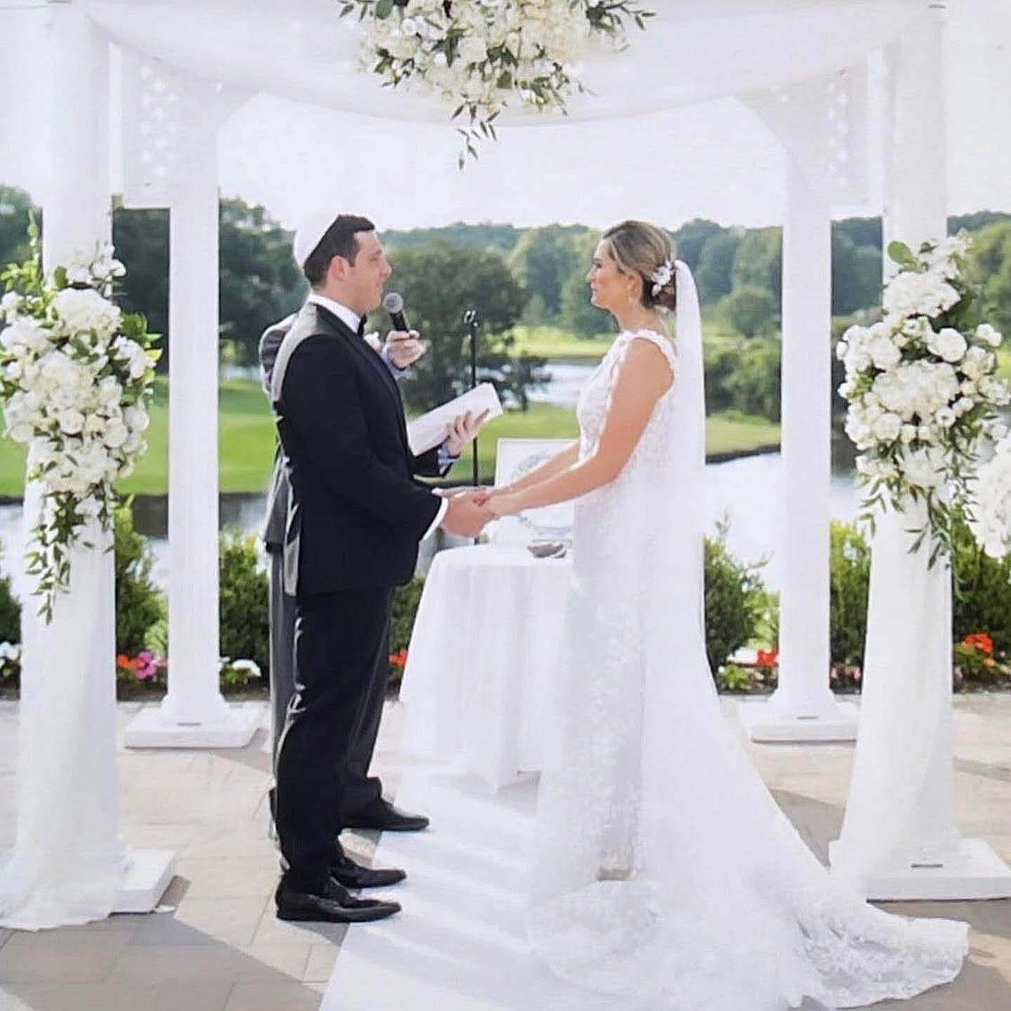 jewish-wedding-nj Couple exchanging vows at a kosher outdoor wedding ceremony in NJ.