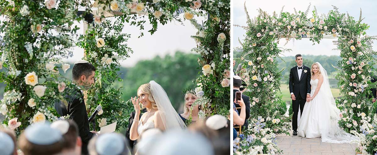 Bride and groom stand under a floral wedding arch during the ceremony, honoring parents and grandparents with heartfelt gestures. Guests are present, and both appear smiling and happy.
